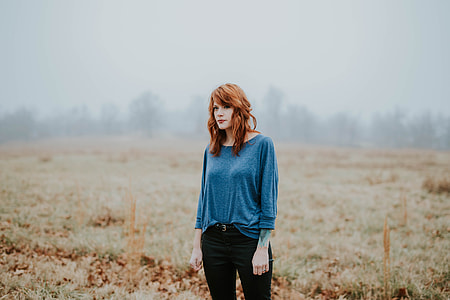 woman standing on grass field thumbnail