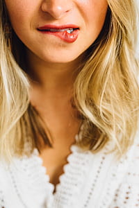 photo of woman biting her lips thumbnail
