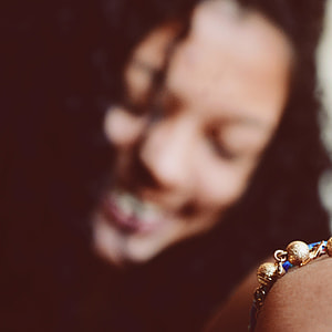 selective focus photography of woman wearing bracelet thumbnail