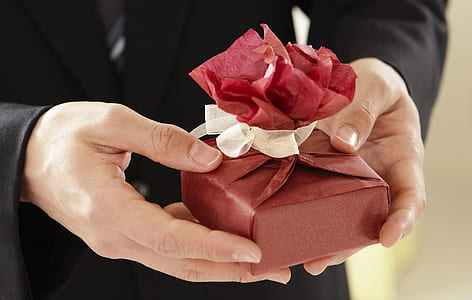 person holding gift thumbnail