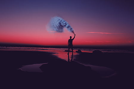 silhouette photo man holding emergency smoke thumbnail