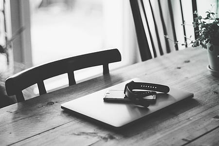 grayscale photography of watch on laptop thumbnail