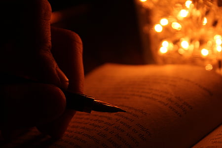 person holding black and silver fountain pen thumbnail