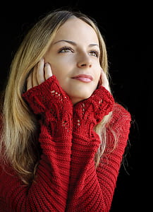 selective focus photography of woman in red knitted sweater thumbnail