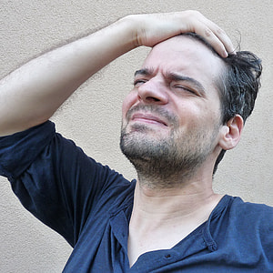 man holding black hair thumbnail