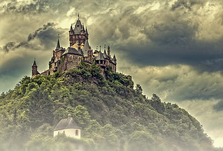brown and gray citadel under cloudy sky thumbnail