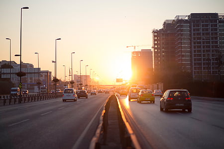 cars running on highway during golden hour thumbnail