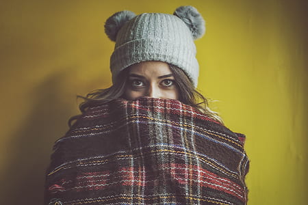woman wearing gray knit cap covered blanket thumbnail