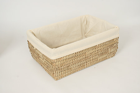 beige woven basket with white cloth thumbnail