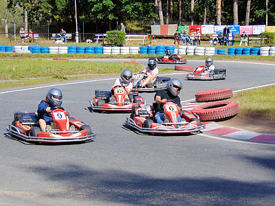 go-kart players racing during daytime thumbnail