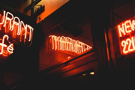 turned on red neon light signage of restaurant thumbnail