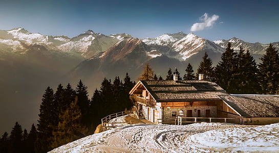 aerial view of brown and white house on top of mountain under clear skies during daytime thumbnail