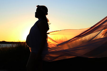 silhouette photography of woman during sunset thumbnail