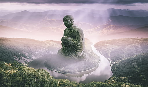 concrete buddha statue surrounded by body of water thumbnail