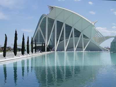 white concrete high-rise building near pool thumbnail