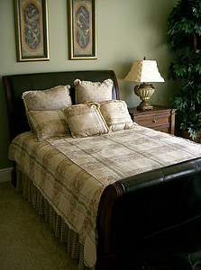 arrange bed sheet set beside brown wooden nightstand thumbnail