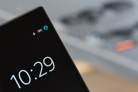 Digital clock and time on mobile smartphone in airplane mode thumbnail