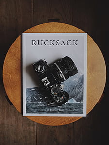 black DSLR camera on Rucksack book thumbnail