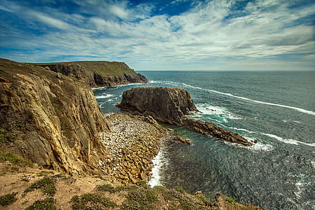 landscape photo of mountain near body of water thumbnail