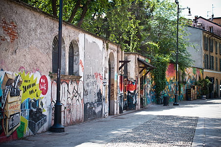 empty road beside wall during daytime thumbnail