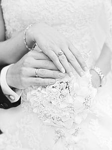greyscale photo of newly weds holding each other's hands thumbnail