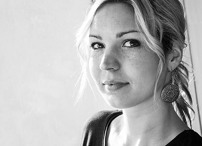 grayscale photo of woman wearing drop earrings thumbnail