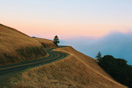 road near cliff and mountain thumbnail