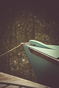 Teal Wooden Boat on Lake thumbnail