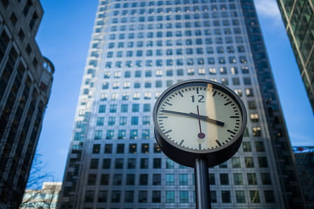 clock near building showing 3:47 thumbnail