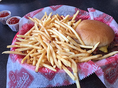 fried potatoes and burger on tray thumbnail