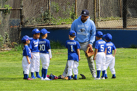 six boy gather with coach on baseball field thumbnail
