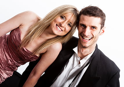 woman beside man in suit jacket both smiling thumbnail
