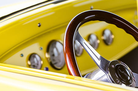 selective focus photography of brown vehicle steering wheel thumbnail