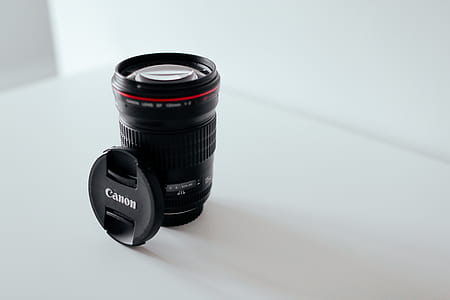 black Canon lens on white table thumbnail