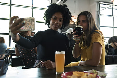 Women Sitting On Chair Taking A Picture thumbnail