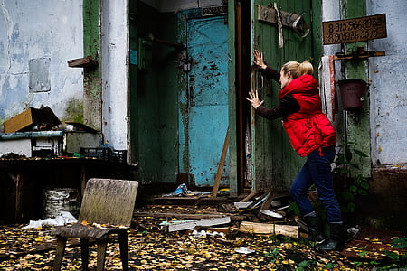 woman pushing door thumbnail