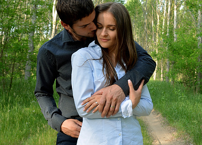 man in black dress shirt beside woman in blue dress shirt thumbnail