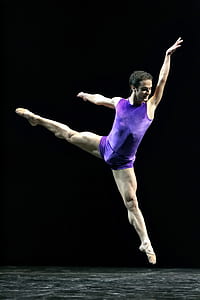 man dancing while wearing purple top thumbnail