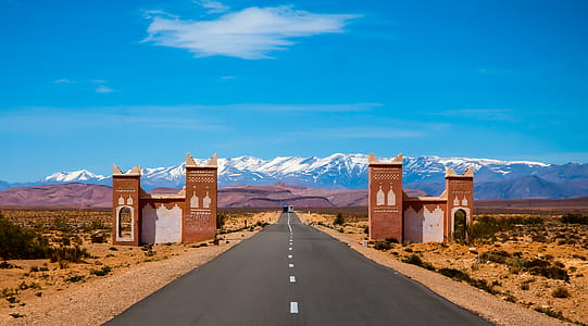 Empty Asphalt Road and Overlooking Mountain thumbnail