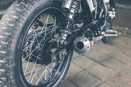 motorcycle with black wheel and gray muffler thumbnail