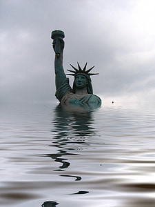 male raising torch statue surrounded by body of water thumbnail