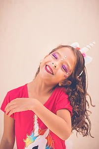 girl wearing red unicorn graphic t-shirt thumbnail