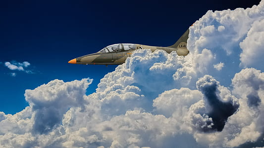 close-up photo of aircraft near clouds thumbnail