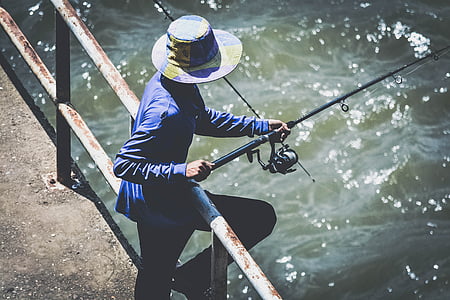 man holding fishing rod thumbnail