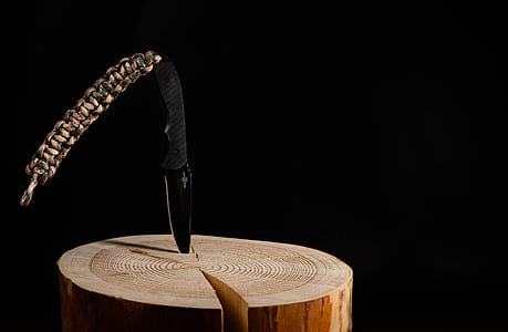 black knife blocked in brown wood stamp thumbnail