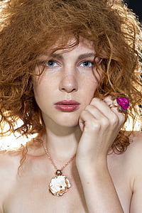 woman's wearing flower necklace and ring thumbnail