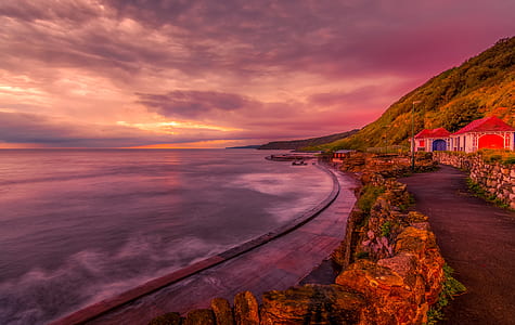 landscape photography of mountain and body of water thumbnail