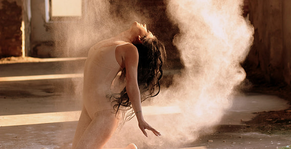 photo of female gymnast and powder inside sunlit room thumbnail