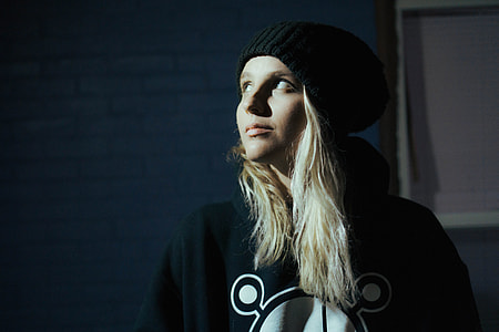 woman wearing knit cap and jacket thumbnail
