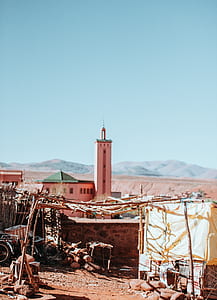 pink concrete building near mountain thumbnail